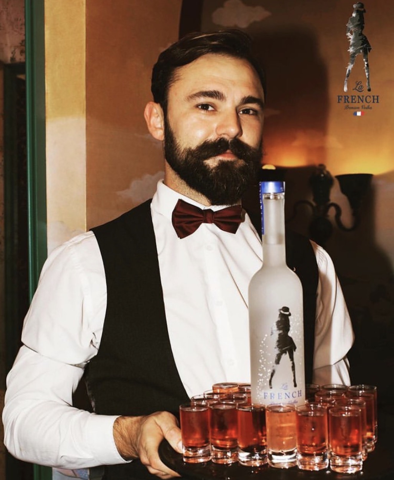 Bartender serving La French Vodka shots