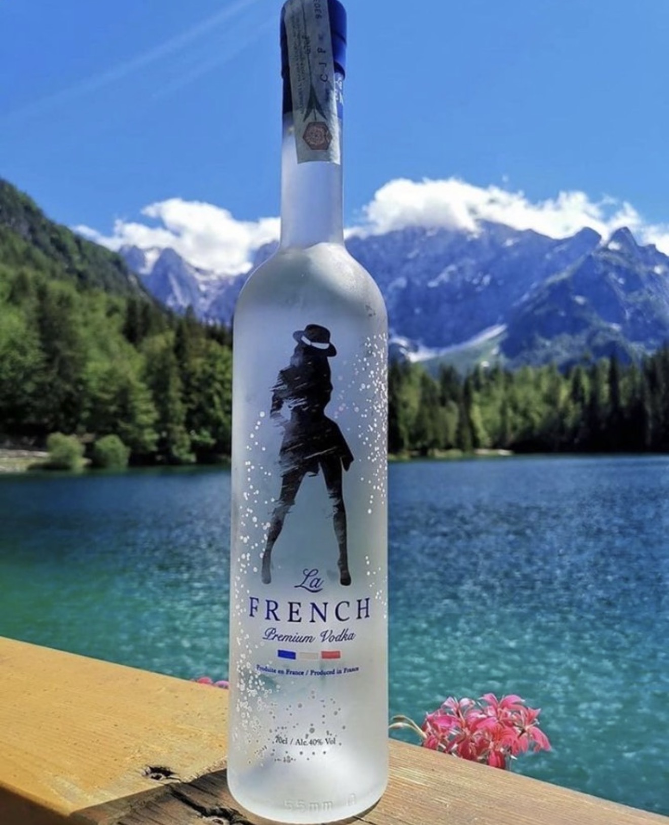 La French Vodka bottle at a mountain lake