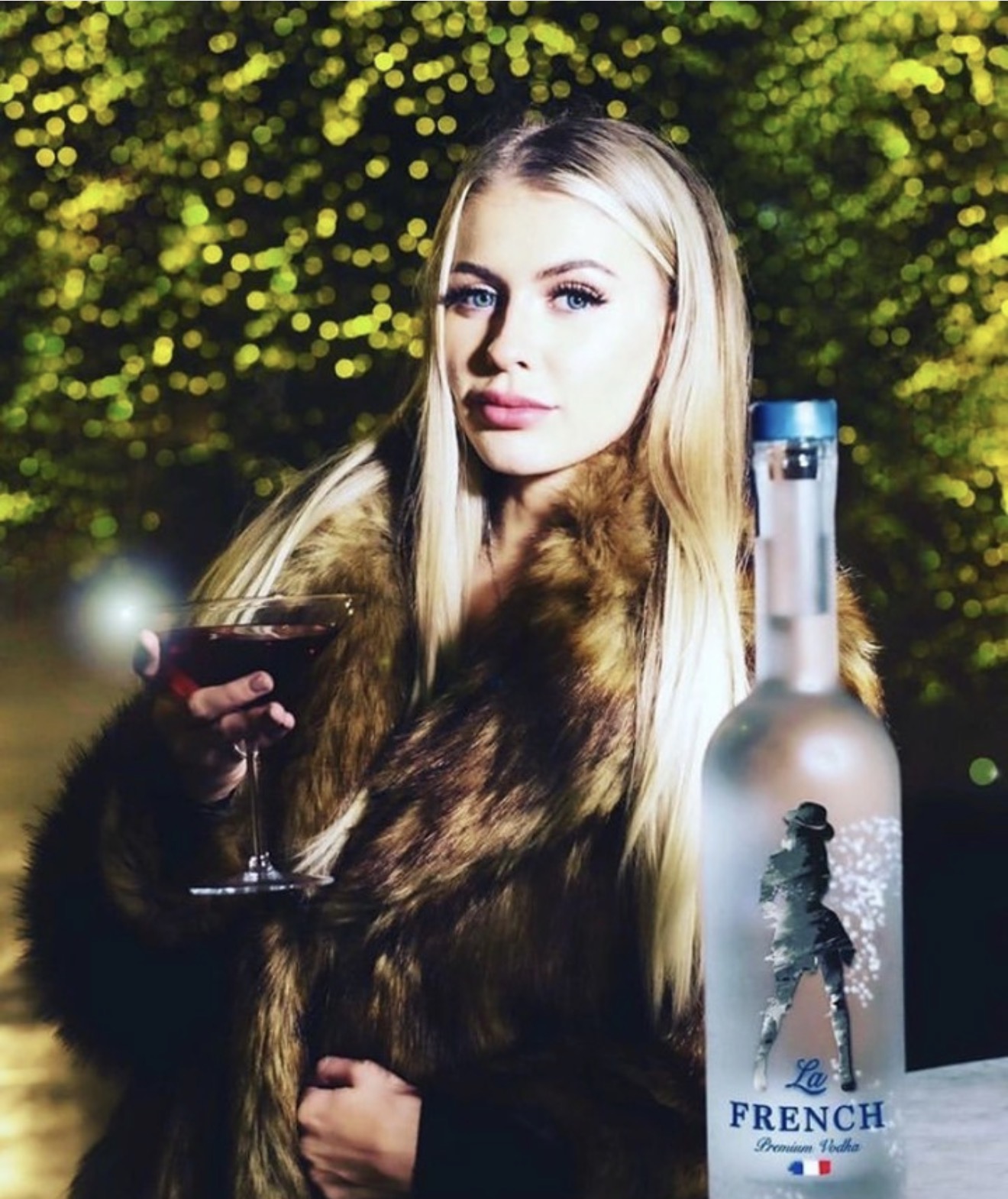 Woman with a La French Vodka cocktail